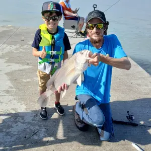 Kyle and his son Carter with the big sheephead Carter caught July 4 2024 (2).jpg